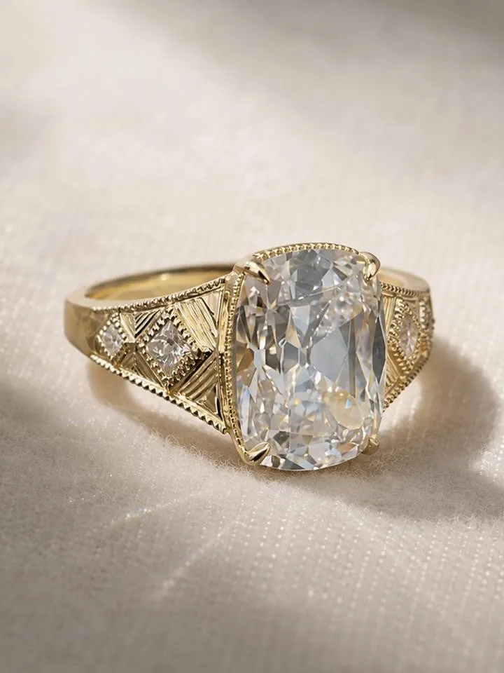 A cushion cut, in an engraved setting