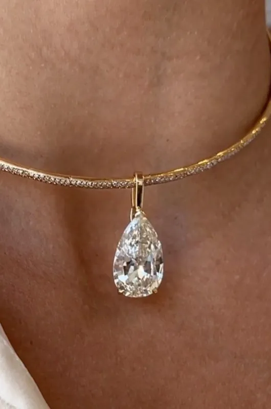 A pear drop, hung from a line necklace